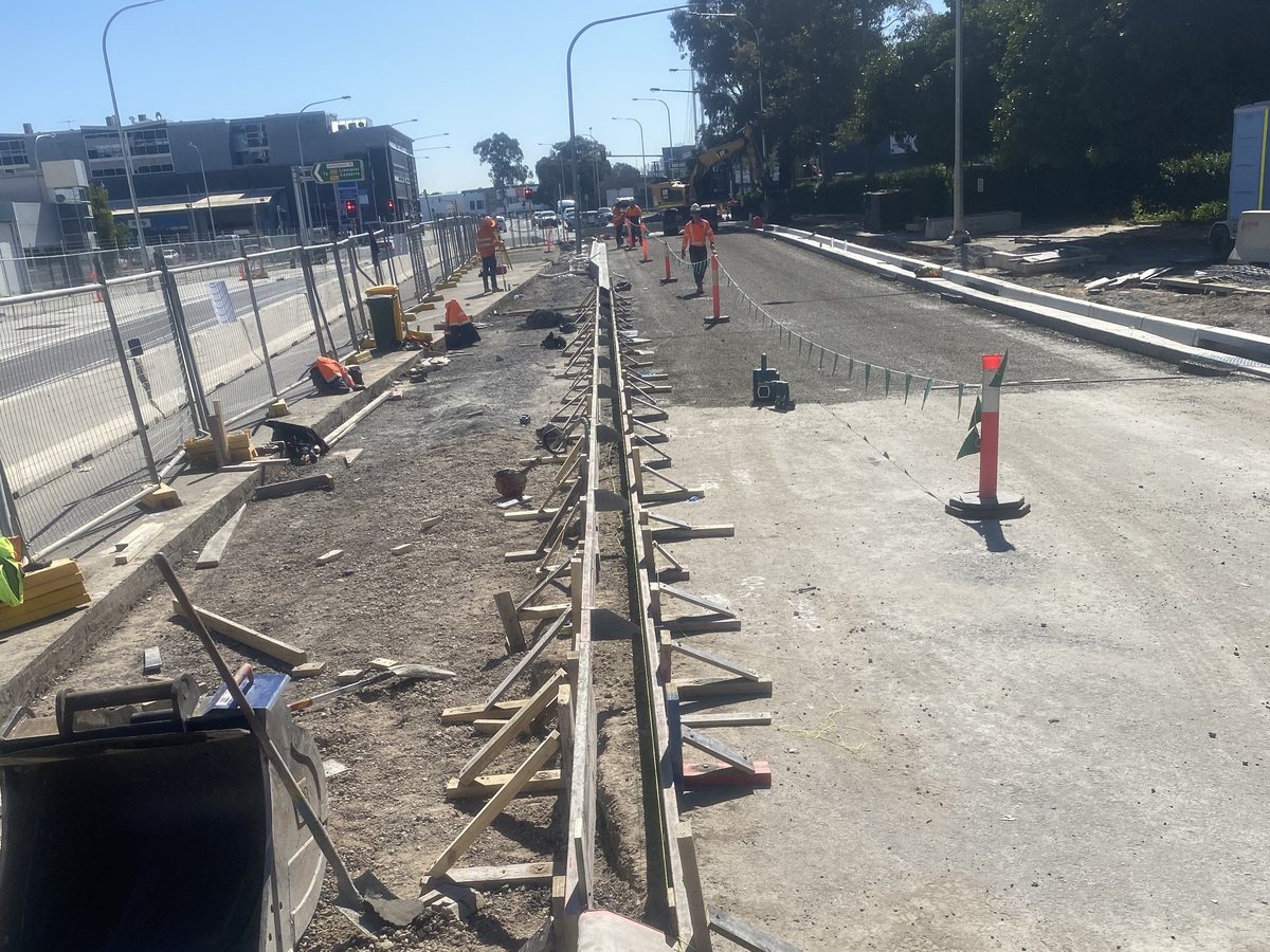 Kerb formwork set out along a road under construction